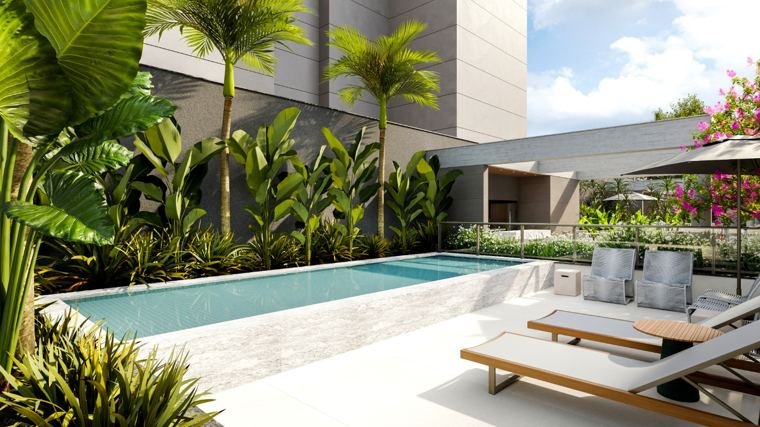 Piscina com deck e paisagismo